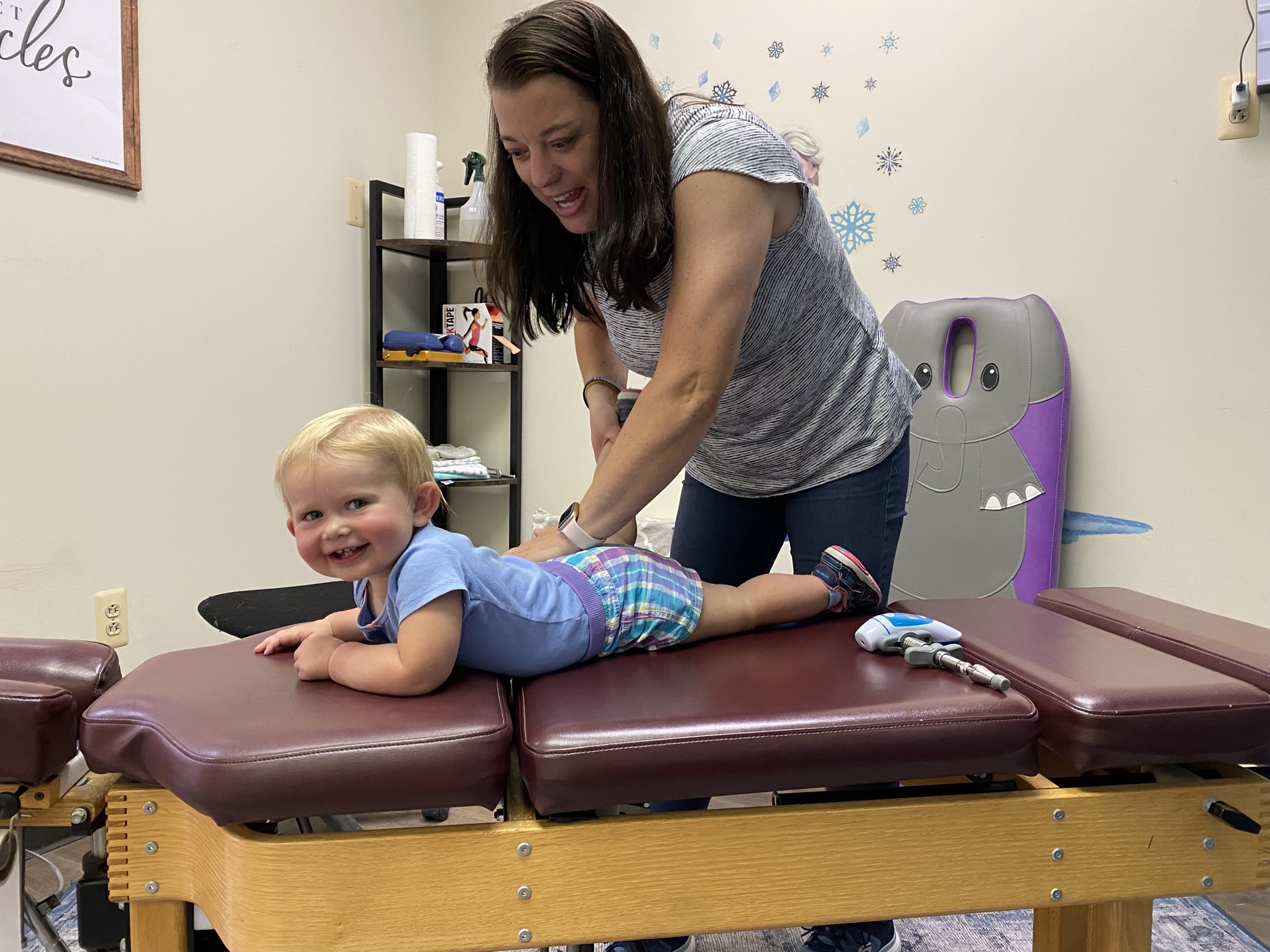 Dr. Brooke adjusts little girl